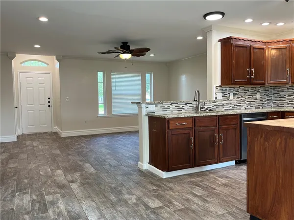 a view of a kitchen cabinets and a wooden floor