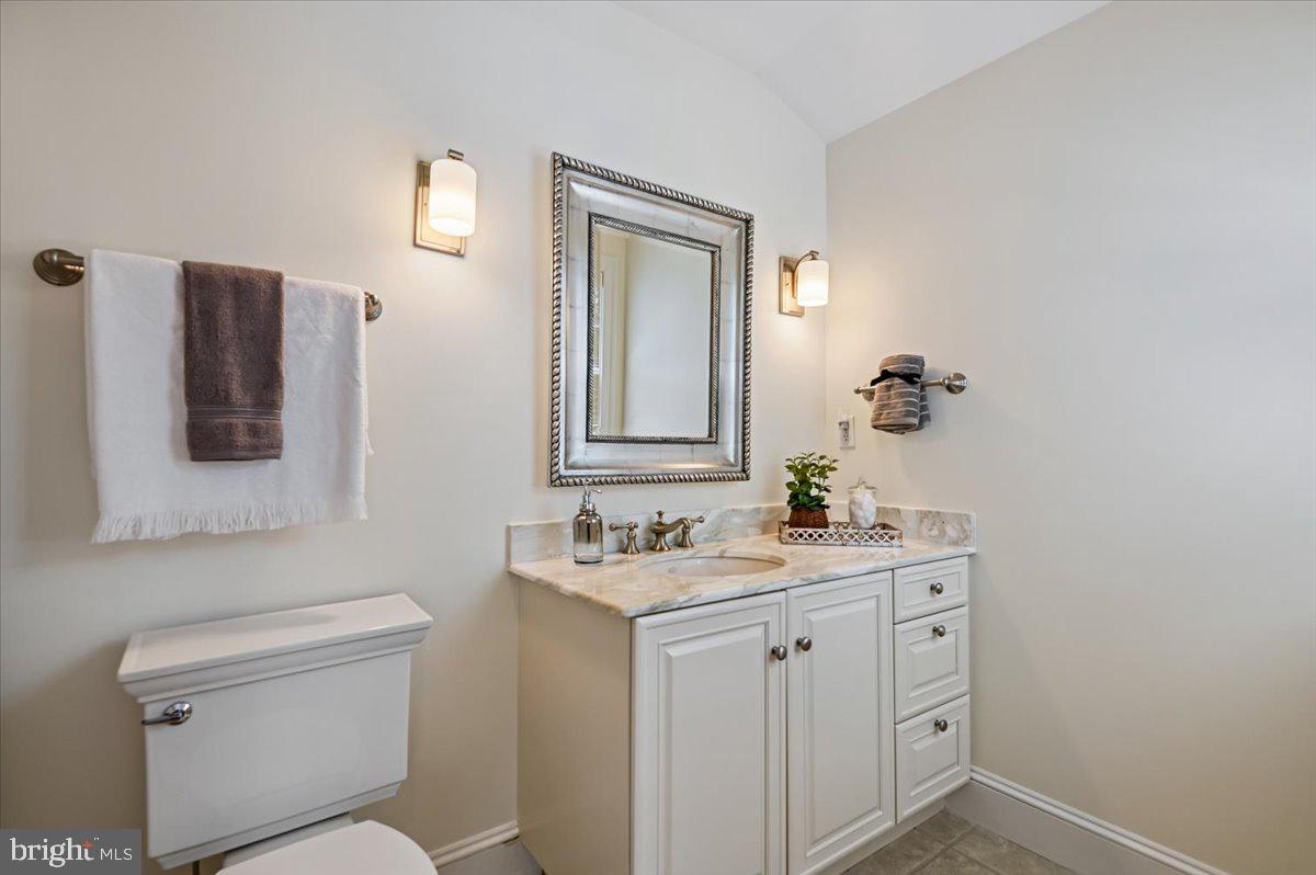 2700 Falling Timber Trail Edgewater, MD 21037 - Photo 36 of 89 a bathroom with a toilet sink and mirror