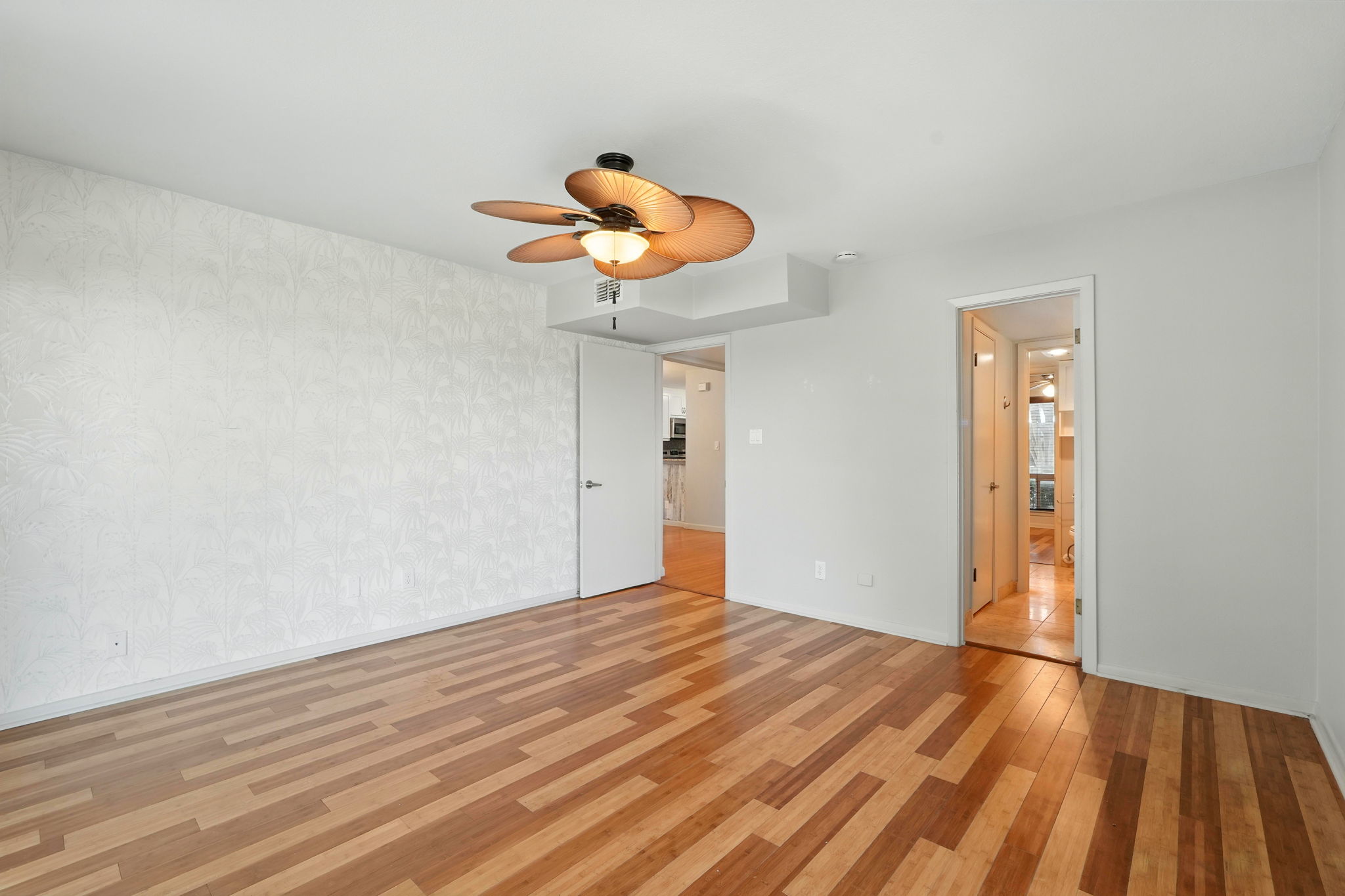 2918 Ranch Road 620 North, Unit C115 Austin, TX 78734 - Photo 17 of 39 Unfurnished bedroom with light wood-type flooring and a ceiling fan