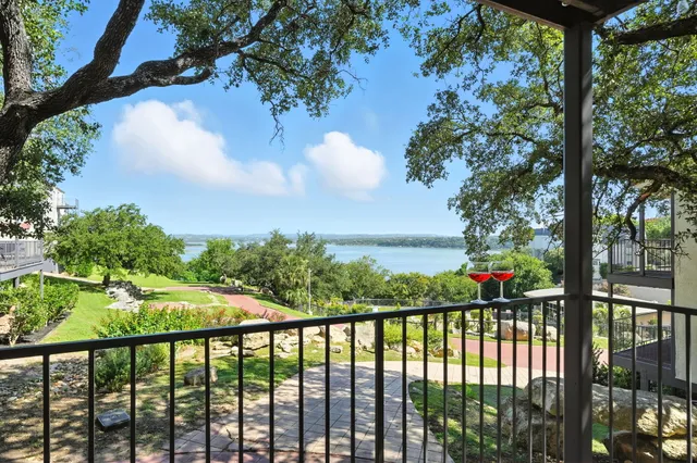 a view of balcony with wooden floor