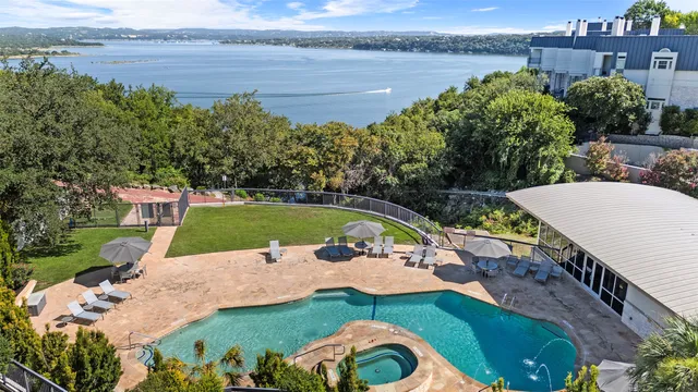 a view of a swimming pool and lounge chair