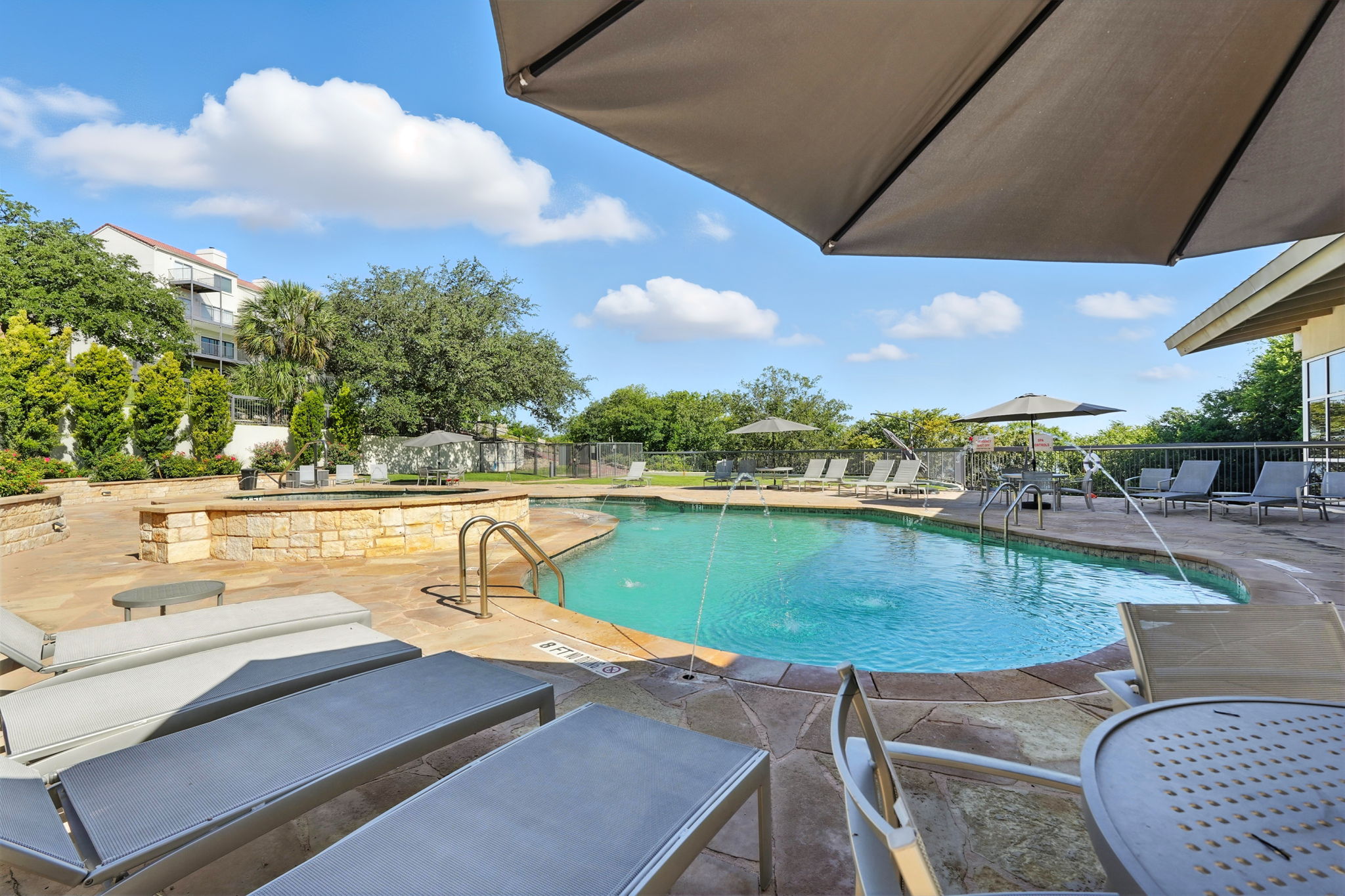 2918 Ranch Road 620 North, Unit C115 Austin, TX 78734 - Photo 30 of 39 Community pool featuring a patio area