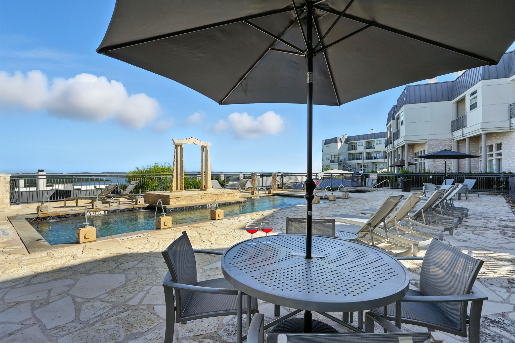 2918 Ranch Road 620 North, Unit C115 Austin, TX 78734 - Photo 35 of 39 View of patio / terrace with a community pool and outdoor dining area