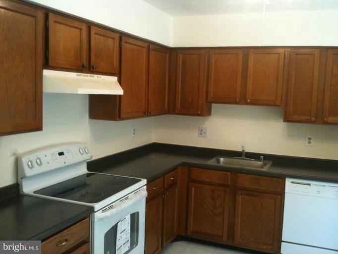 5761 Independence Circle Alexandria, VA 22312 - Photo 2 of 8 a kitchen with a sink and cabinets