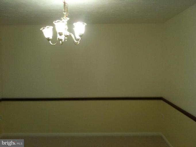 5761 Independence Circle Alexandria, VA 22312 - Photo 3 of 8 a view of a room with a fireplace