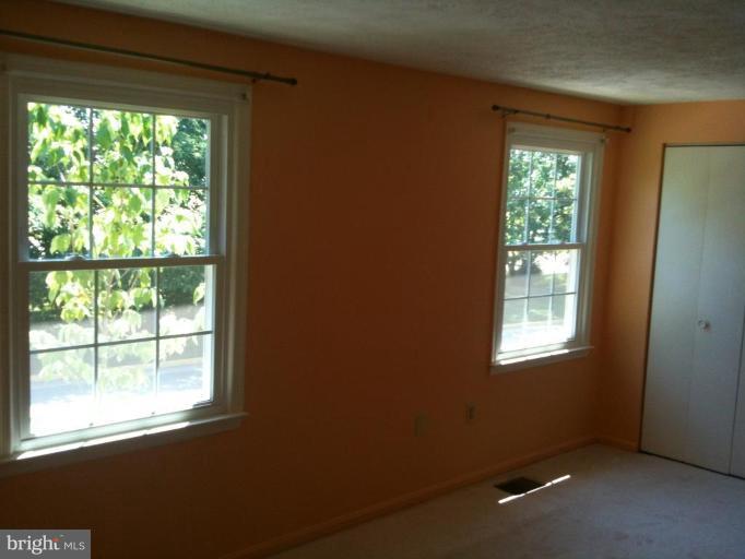 5761 Independence Circle Alexandria, VA 22312 - Photo 4 of 8 a view of an empty room with a window