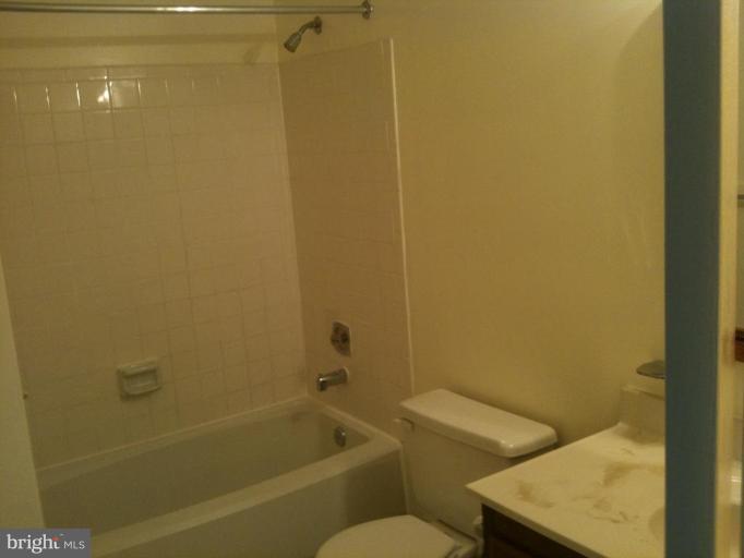 5761 Independence Circle Alexandria, VA 22312 - Photo 5 of 8 a bathroom with a sink and a bathtub