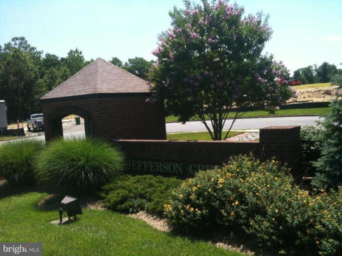 5761 Independence Circle Alexandria, VA 22312 - Photo 8 of 8 a front view of a house with a yard