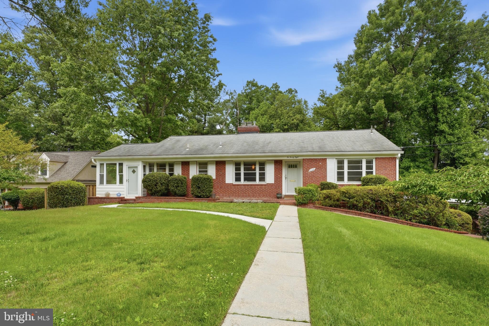 228 Northwest Terrace Silver Spring, MD 20901 - Photo 2 of 70 a front view of a house with a garden