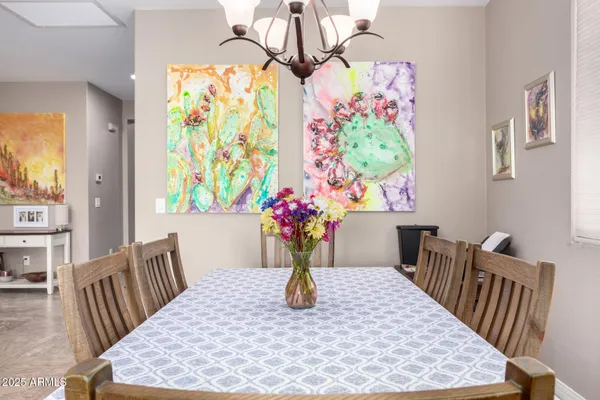 a view of a dining room with furniture window and flowerpot