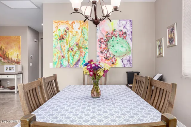 a view of a dining room with furniture window and flowerpot