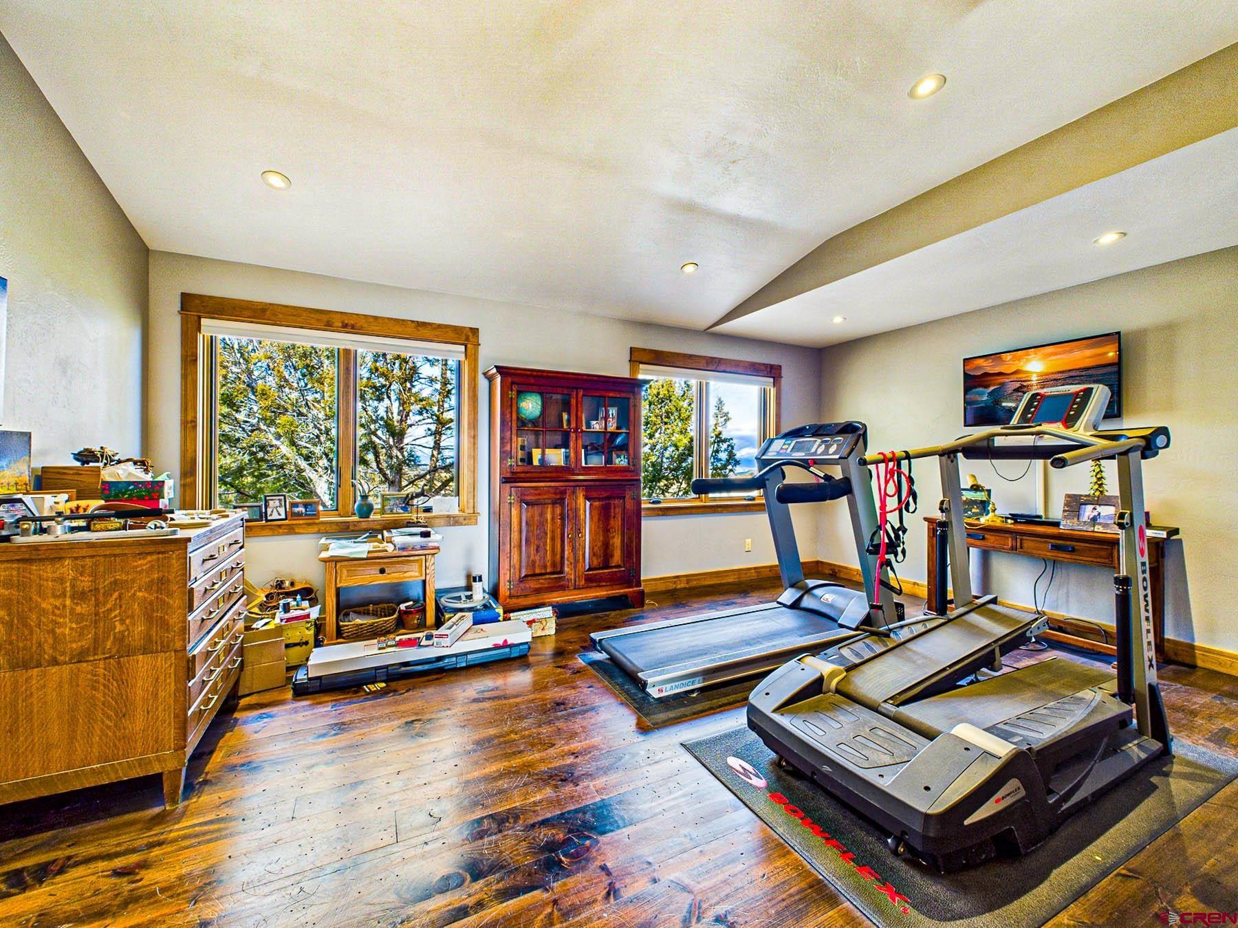 2741 7750th Road Crawford, CO 81415 - Photo 15 of 45 a living room with lots of furniture and a wooden floor