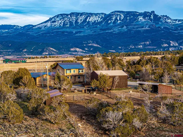 a view of a swimming pool with an outdoor seating