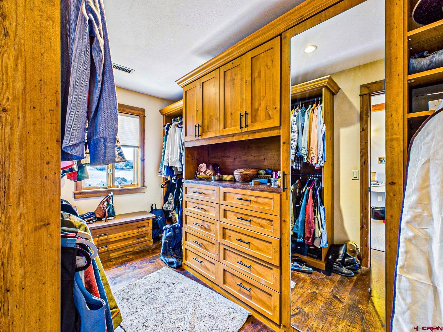 2741 7750th Road Crawford, CO 81415 - Photo 24 of 45 a view of walk in closet with clothes and shoes
