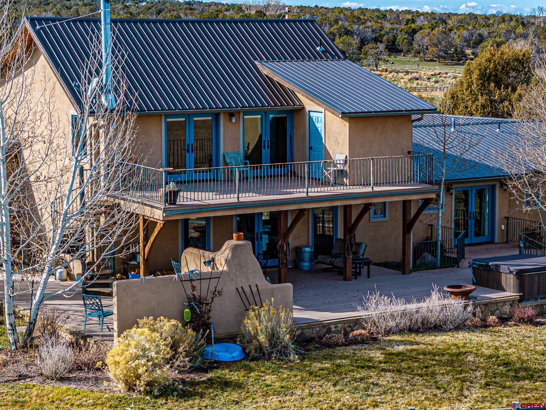 2741 7750th Road Crawford, CO 81415 - Photo 30 of 45 a front view of a house with swimming pool