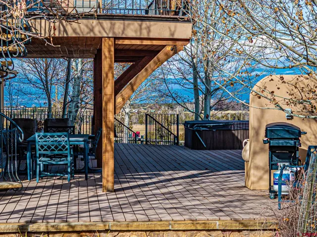 a view of back yard and deck with patio
