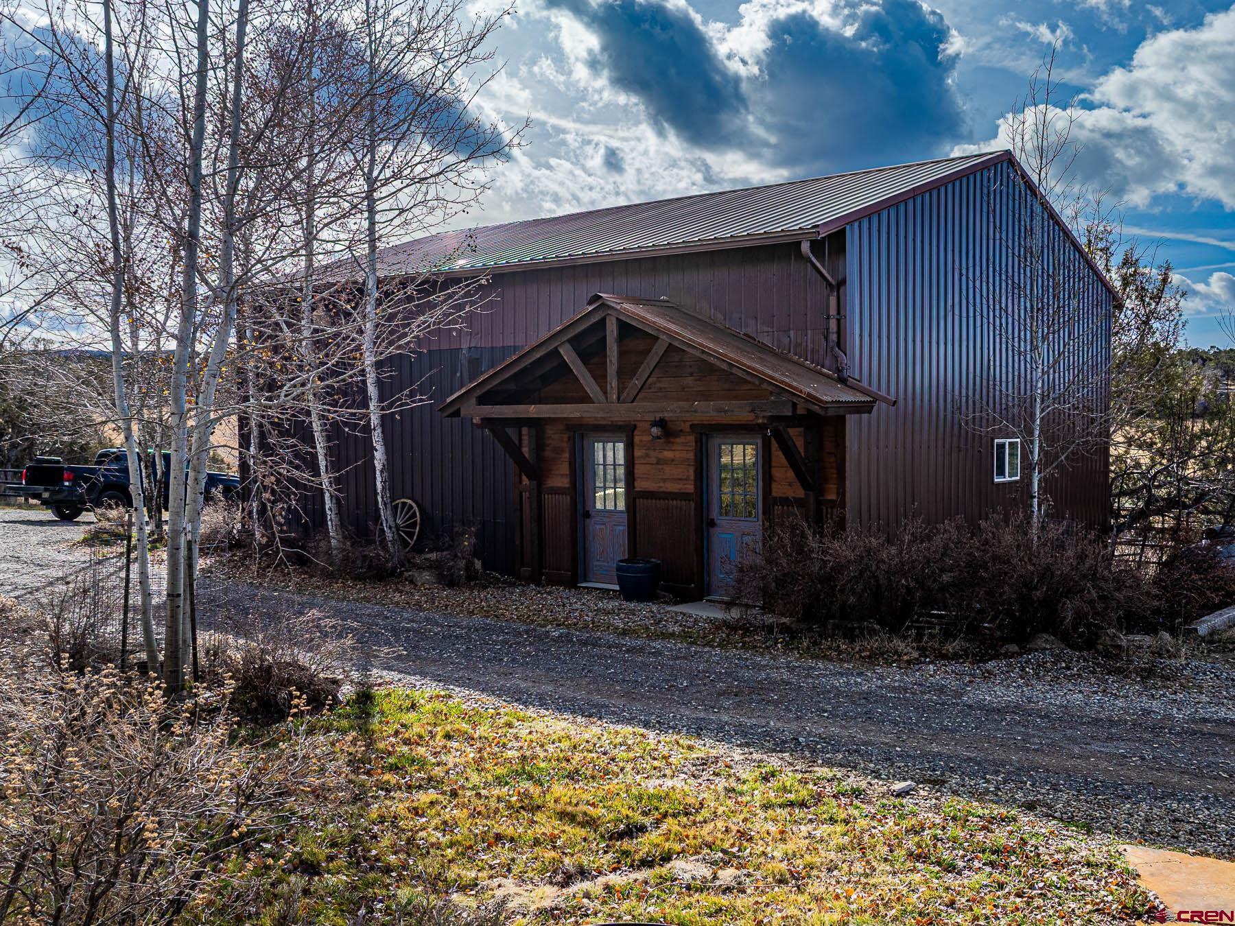 2741 7750th Road Crawford, CO 81415 - Photo 32 of 45 a front view of a house with garden
