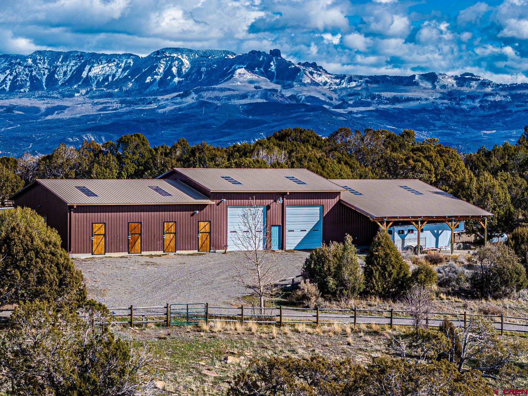 2741 7750th Road Crawford, CO 81415 - Photo 38 of 45 a view of a house with a garden