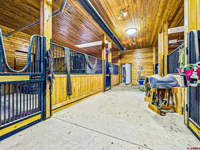a view of a parking space with wooden fence