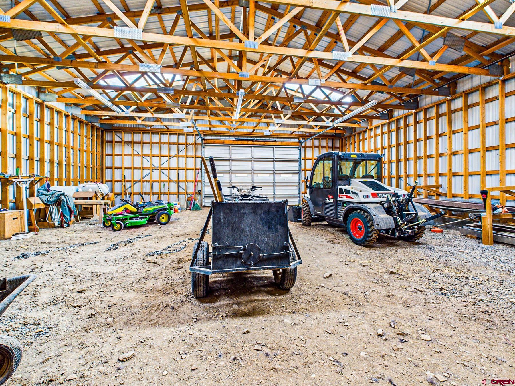2741 7750th Road Crawford, CO 81415 - Photo 41 of 45 a view of a garage with a car parked