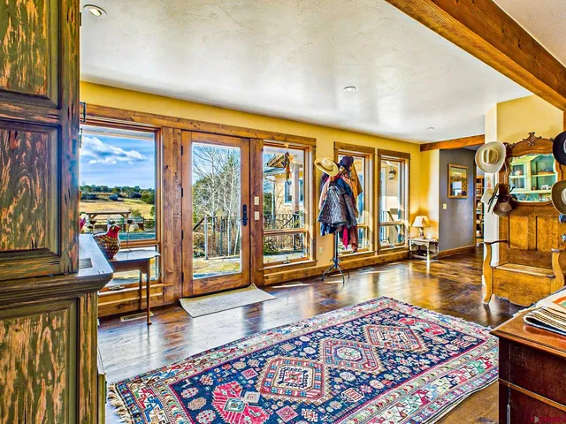 a living room with furniture and a table