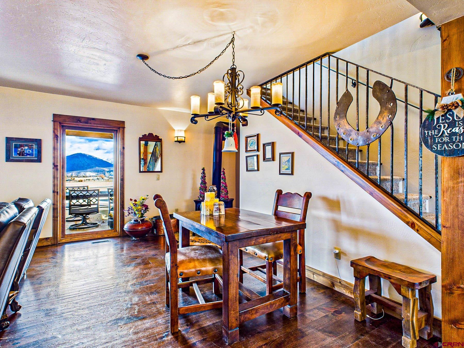 2741 7750th Road Crawford, CO 81415 - Photo 9 of 45 a dining room with furniture entryway and wooden floor