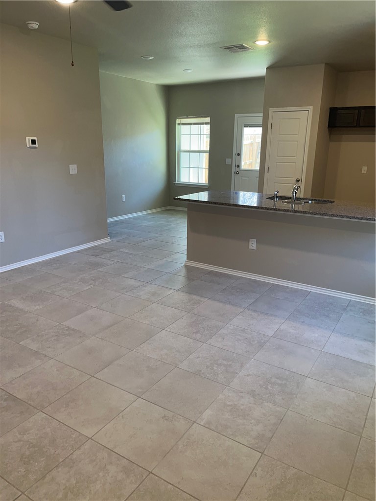 1139 Garland Road Georgetown, TX 78626 - Photo 4 of 14 an empty room with a empty space and windows