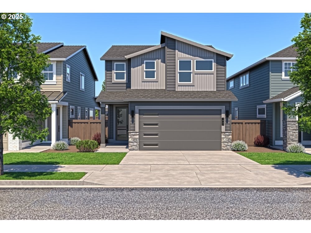 a front view of a house with a yard and garage