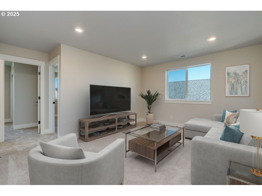 1330 East Canto Street Newberg, OR 97132 - Photo 7 of 9 a living room with furniture and a flat screen tv