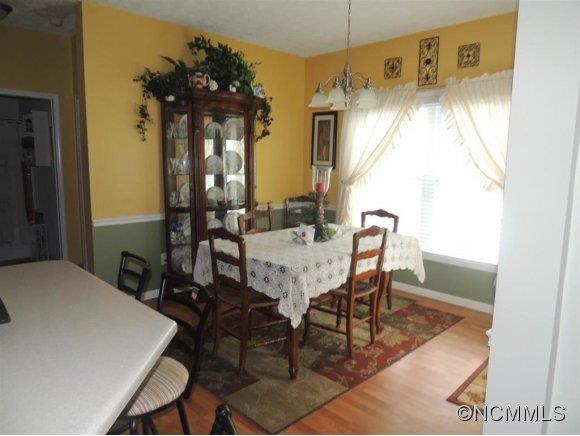 685 Lattimore Road Rutherfordton, NC 28139 - Photo 6 of 11 a view of a dining room with furniture and chandelier