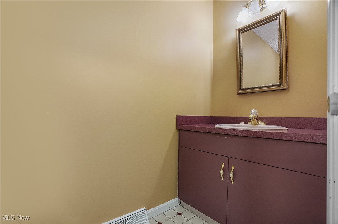 1094 San Raphael Drive Akron, OH 44333 - Photo 27 of 50 Bathroom with vanity and baseboards