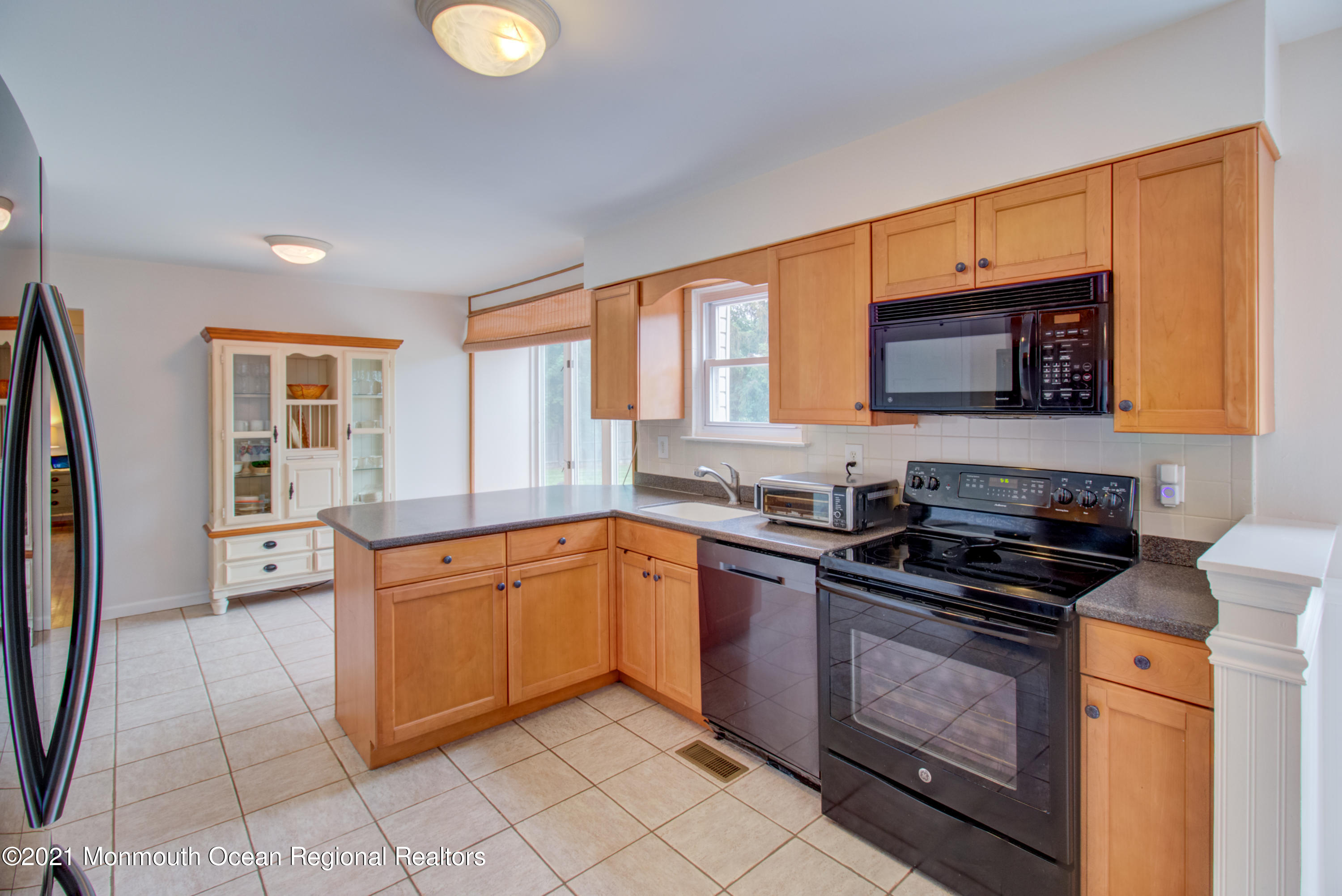 463 Flock Road Hamilton, NJ 08619 - Photo 11 of 24 a kitchen with stainless steel appliances granite countertop a stove microwave and sink