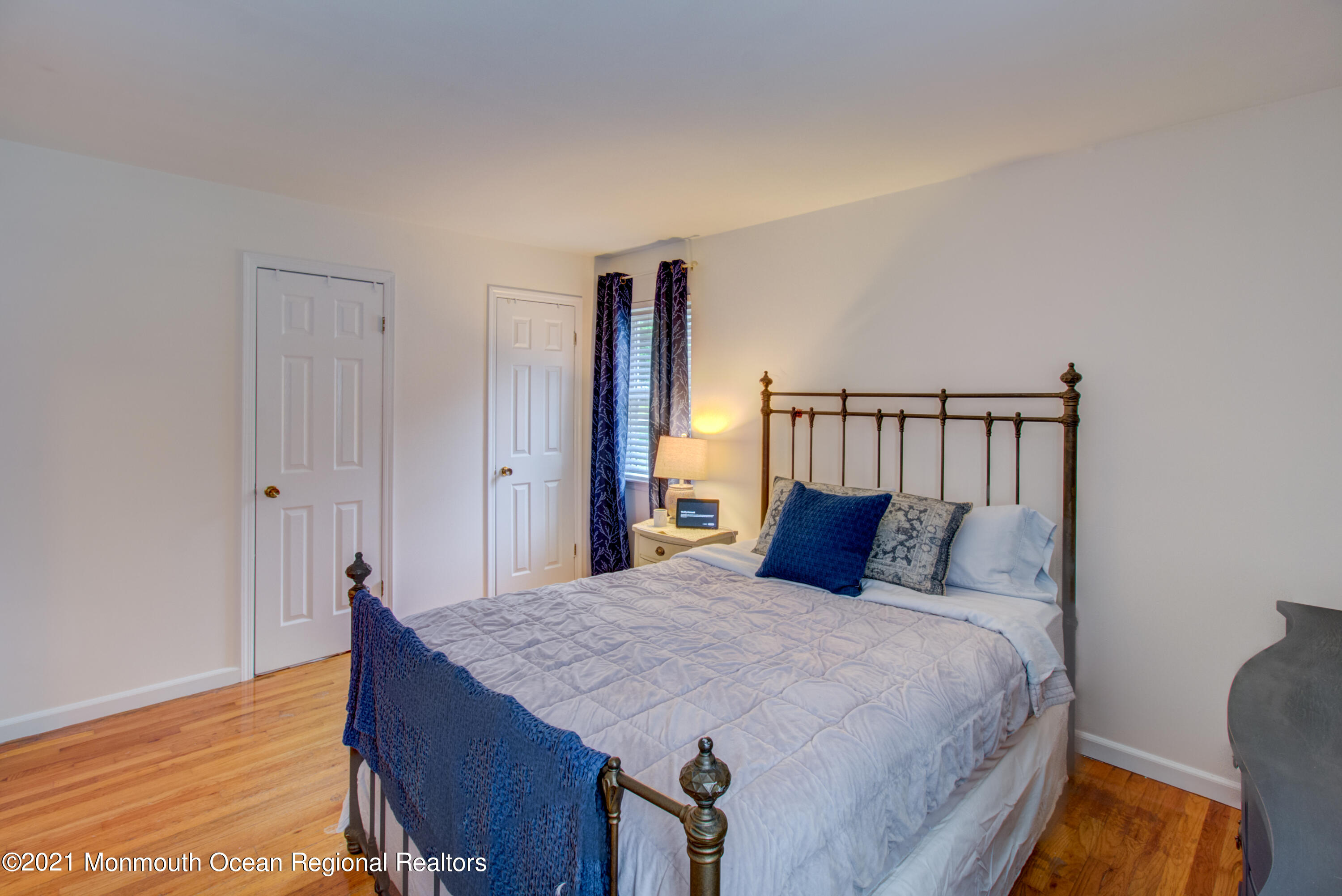 463 Flock Road Hamilton, NJ 08619 - Photo 16 of 24 a bedroom with a large bed and wooden floor