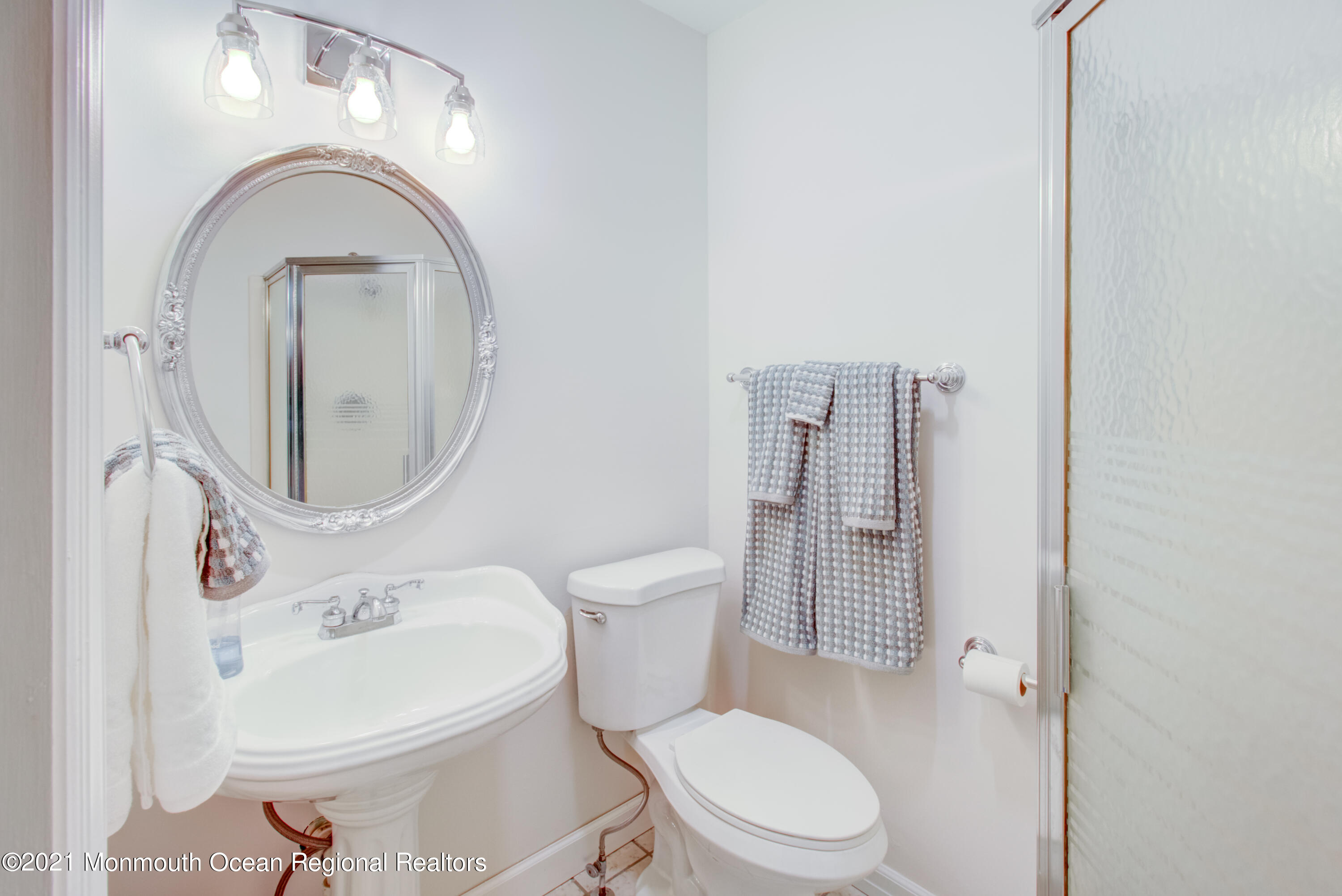 463 Flock Road Hamilton, NJ 08619 - Photo 20 of 24 a white toilet sitting next to a bathroom sink