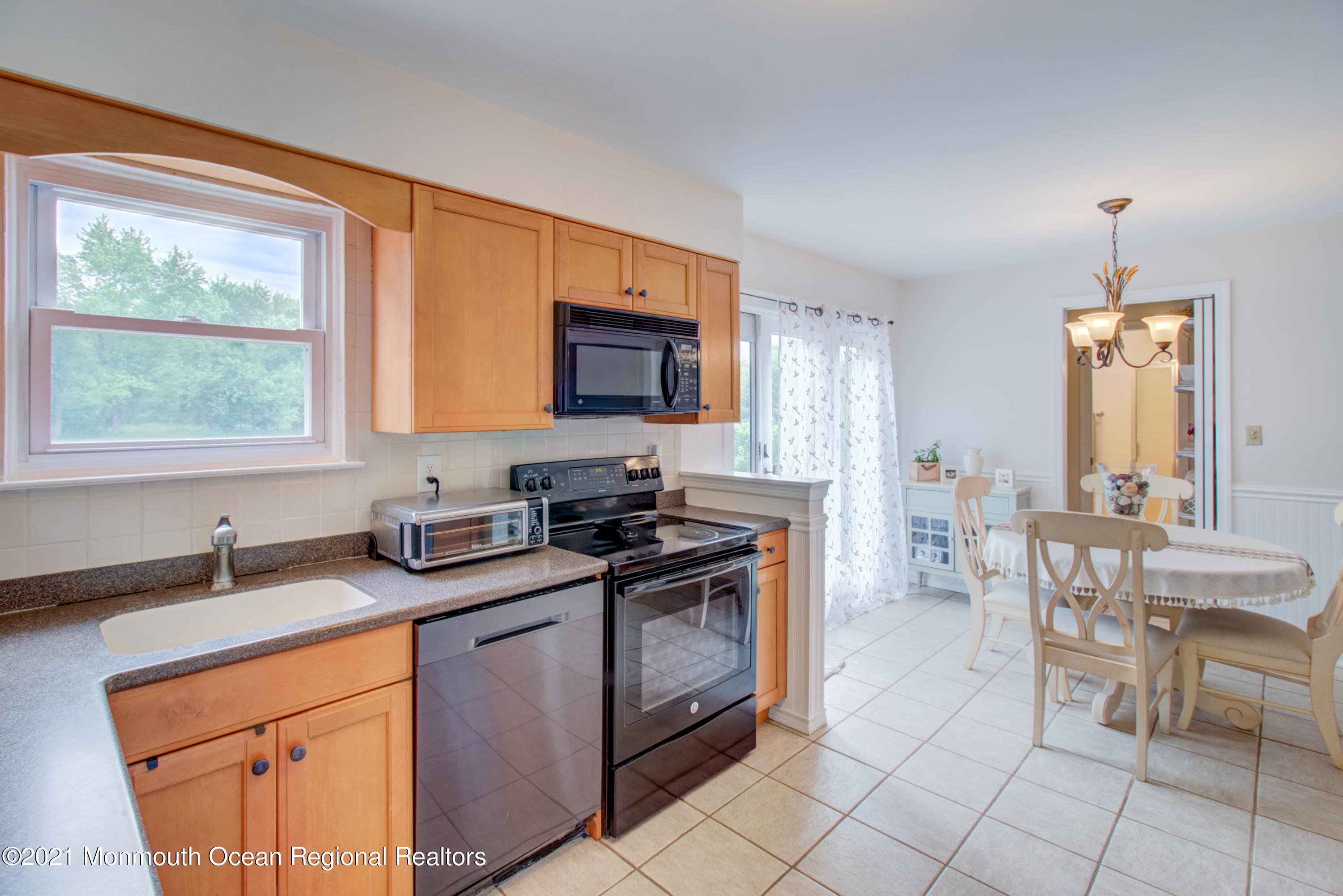 463 Flock Road Hamilton, NJ 08619 - Photo 10 of 24 a kitchen with granite countertop a sink stainless steel appliances and cabinets
