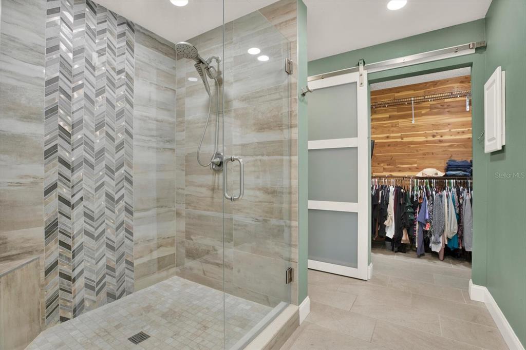 7487 River Country Drive Weeki Wachee, FL 34607 - Photo 31 of 53 a bathroom with a shower and a sink