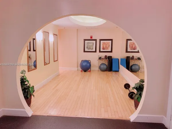 a view of a livingroom with furniture and stairs