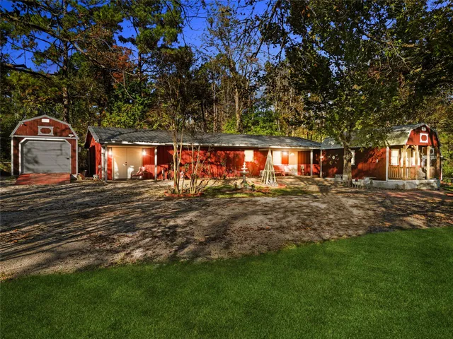 a view of outdoor space with garden and tree