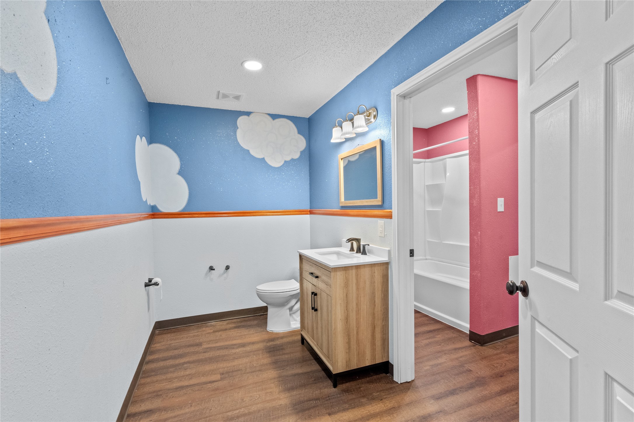 194 County Road 2775 Colmesneil, TX 75938 - Photo 11 of 22 a bathroom with a sink mirror and vanity