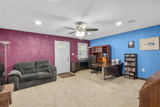 a living room with furniture and closet