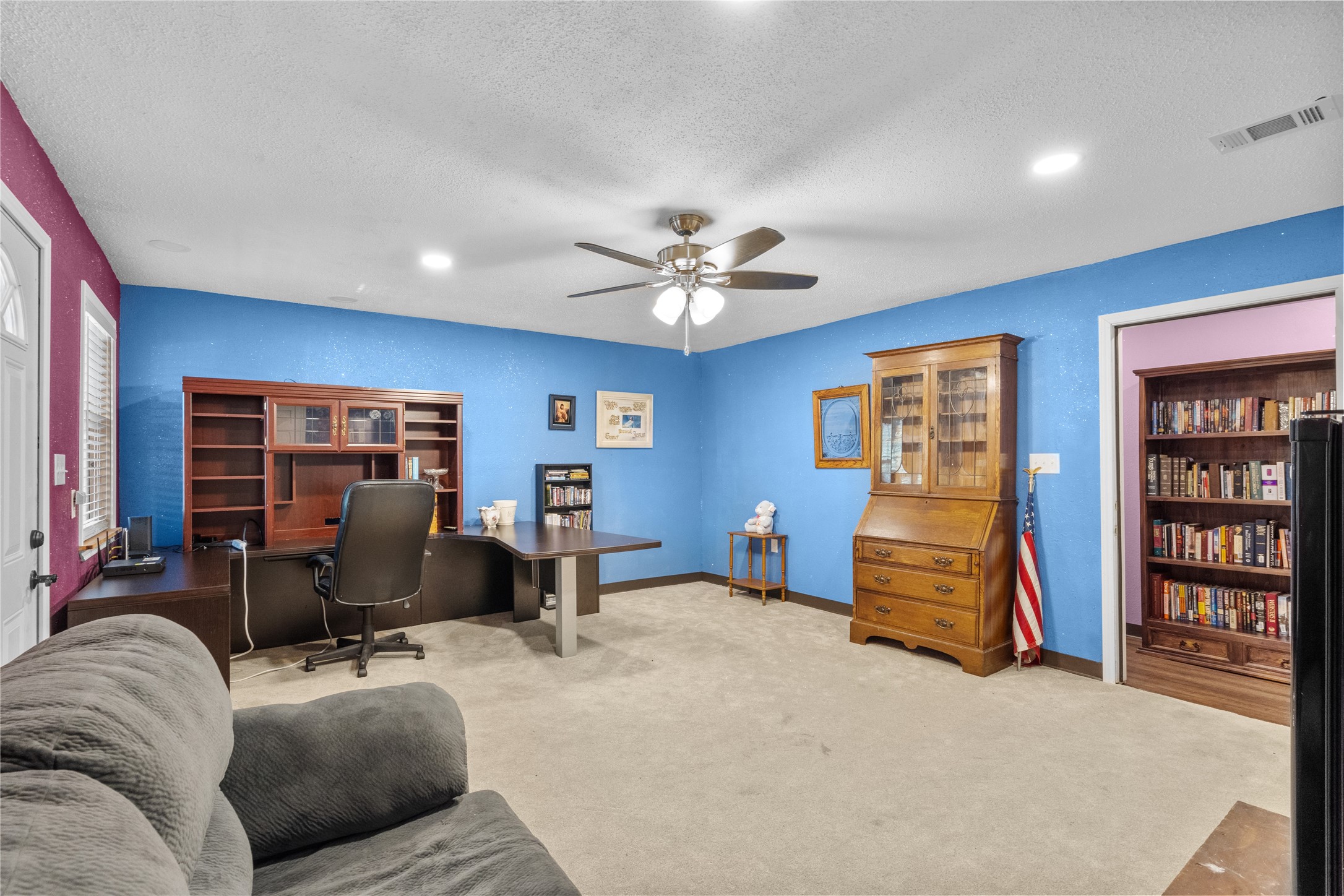 194 County Road 2775 Colmesneil, TX 75938 - Photo 16 of 22 a living room with furniture and closet