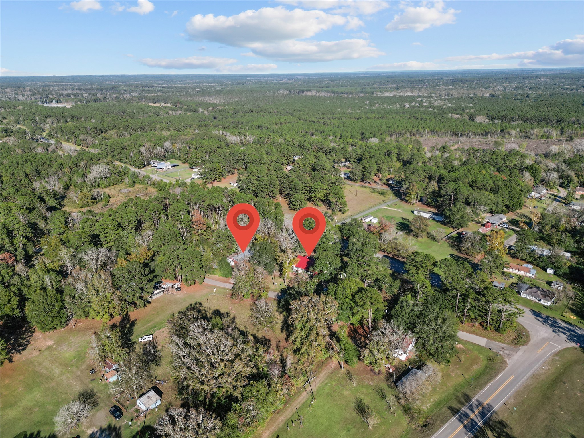 194 County Road 2775 Colmesneil, TX 75938 - Photo 20 of 22 an aerial view of residential houses with outdoor space