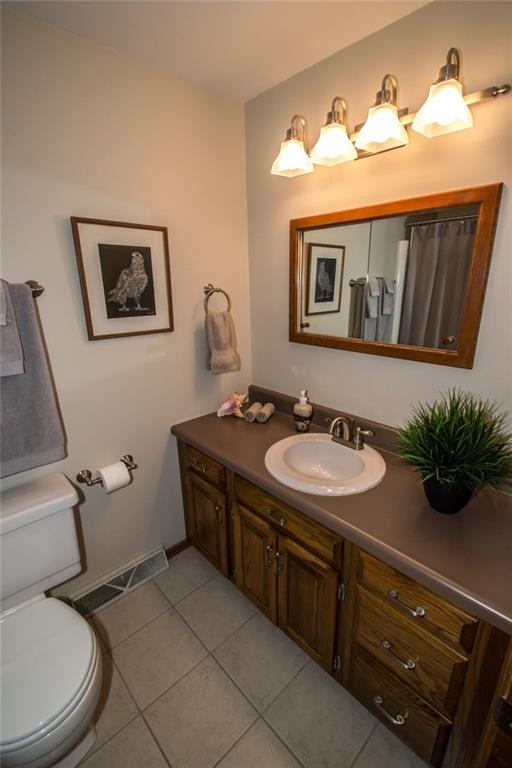 1880 Ferguson Road Allison Park, PA 15101 - Photo 22 of 24 The hall bath has ceramic tile flooring, a tub and shower, and an oversized vanity.