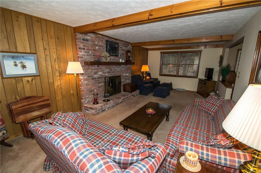 1880 Ferguson Road Allison Park, PA 15101 - Photo 10 of 24 A large family room with a brick fireplace and beamed ceiling.