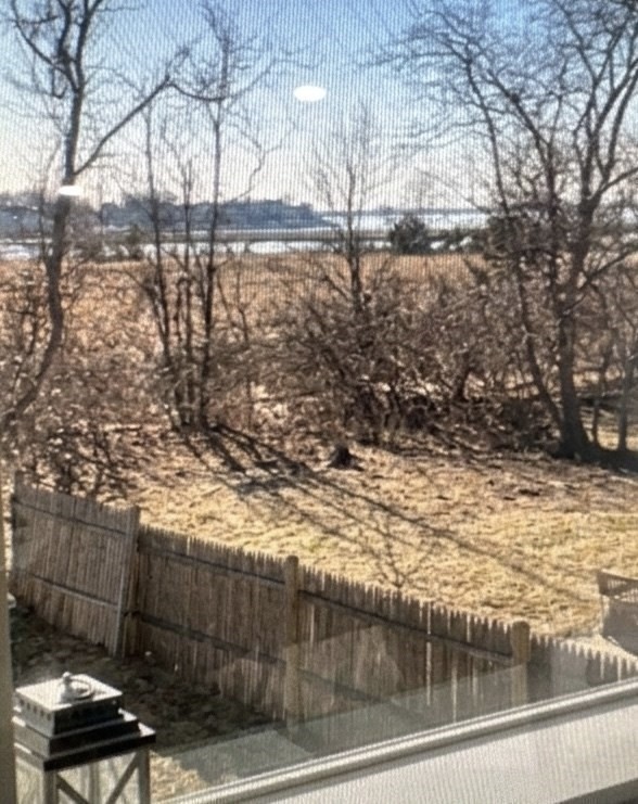 67 Newport Road Hull, MA 02045 - Photo 11 of 26 a view of a lake from a yard
