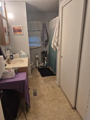 a reading room with furniture and book shelf