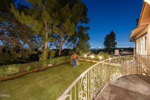 a view of a balcony with swimming pool