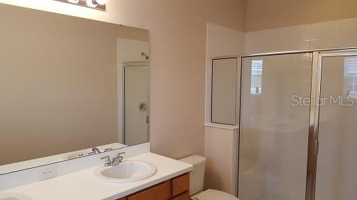 7652 Ripplepointe Way Windermere, FL 34786 - Photo 10 of 21 a bathroom with a sink toilet and shower