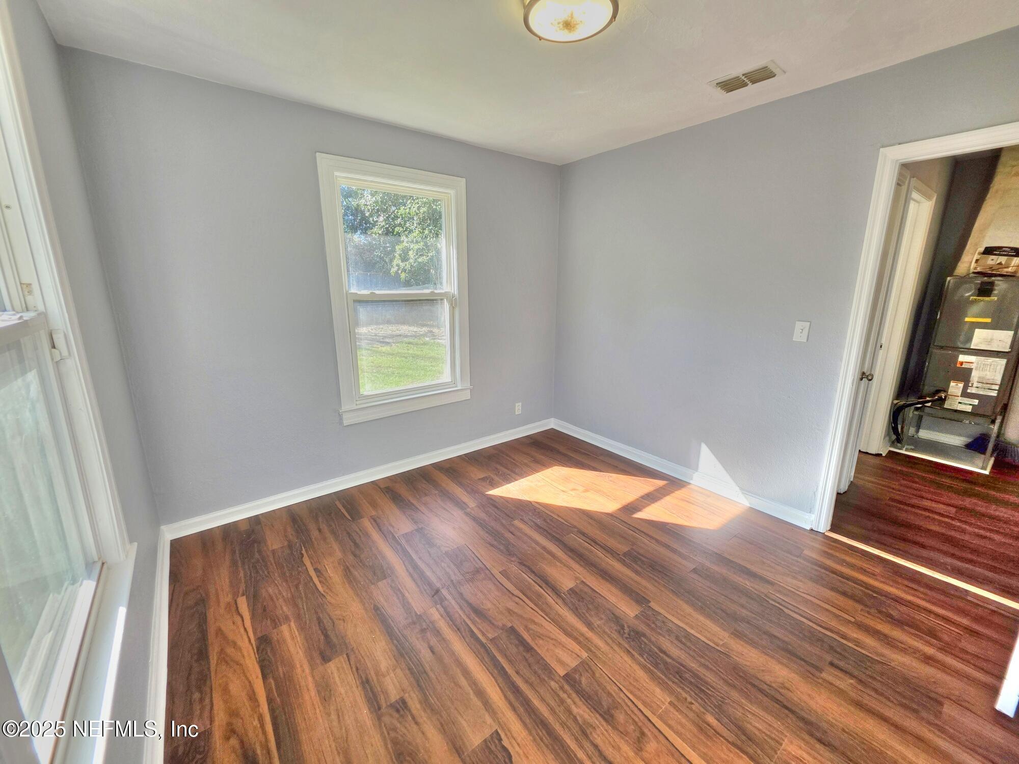 616 Woodbine Street Jacksonville, FL 32206 - Photo 18 of 25 a view of empty room with wooden floor and fan