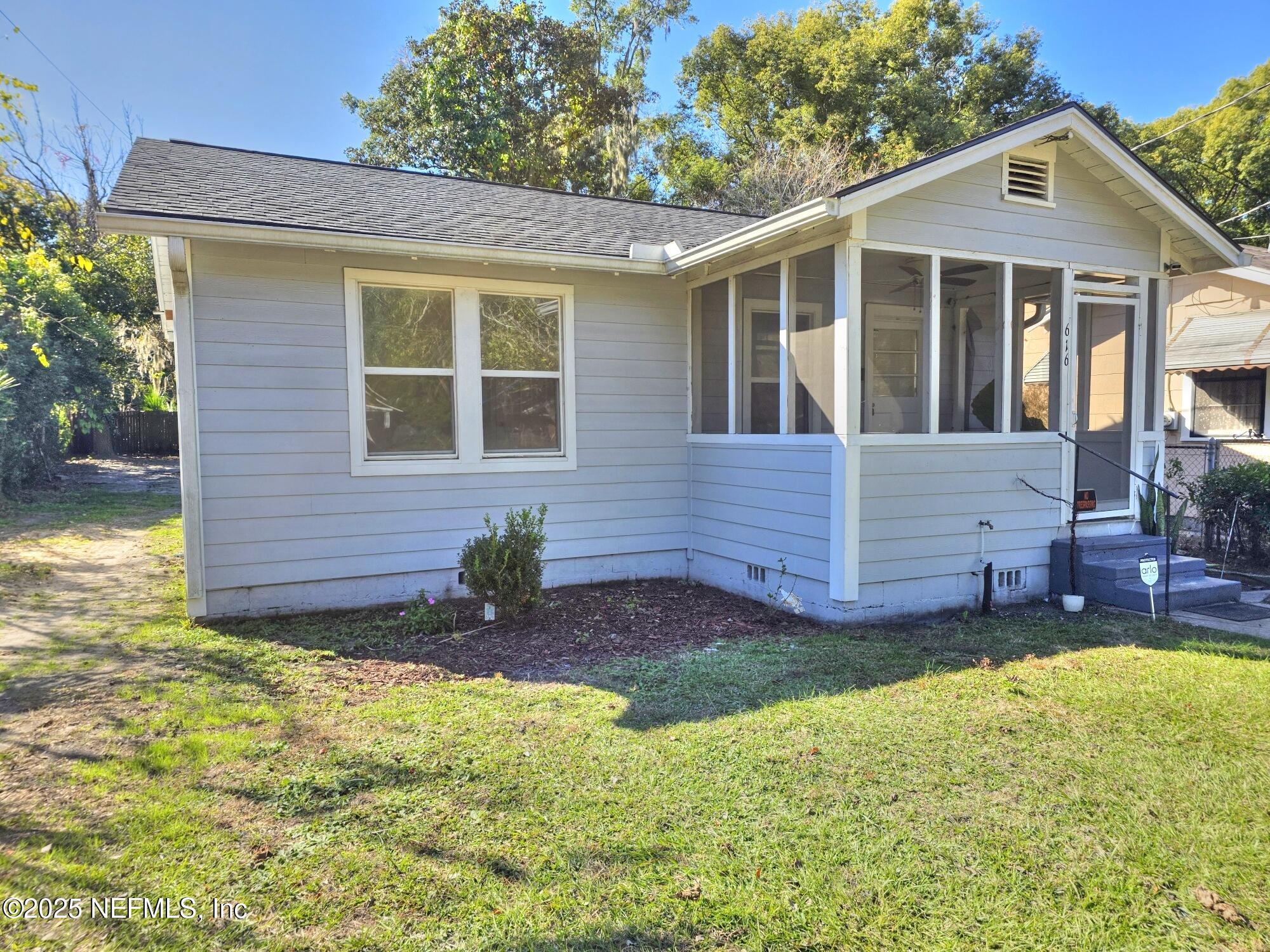 616 Woodbine Street Jacksonville, FL 32206 - Photo 2 of 25 a view of a house with a yard